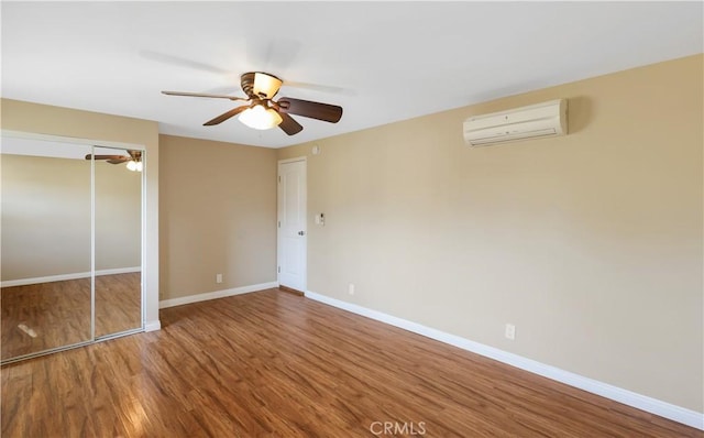 1305 W Beverly Dr, Orange, CA 92868 - unfurnished bedroom featuring a wall unit AC, wood finished floors, a closet, and ceiling fan