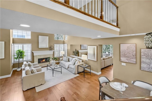 24676 Vista Cerritos, Calabasas, CA 91302 - living room featuring a high ceiling, a tile fireplace, and wood finished floors