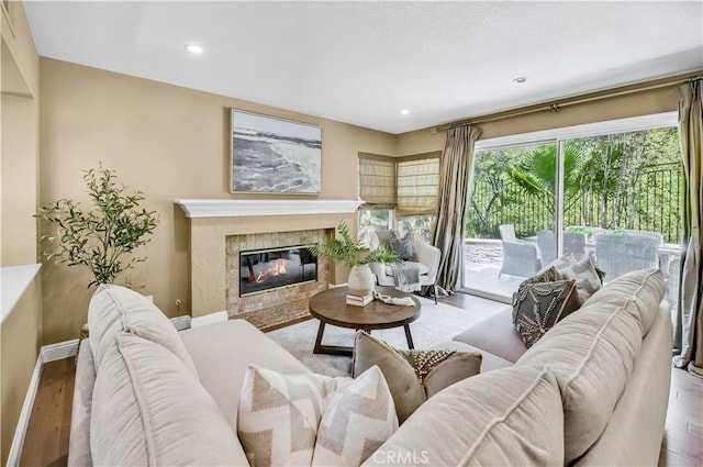 24676 Vista Cerritos, Calabasas, CA 91302 - living room featuring wood finished floors, a high end fireplace, and recessed lighting