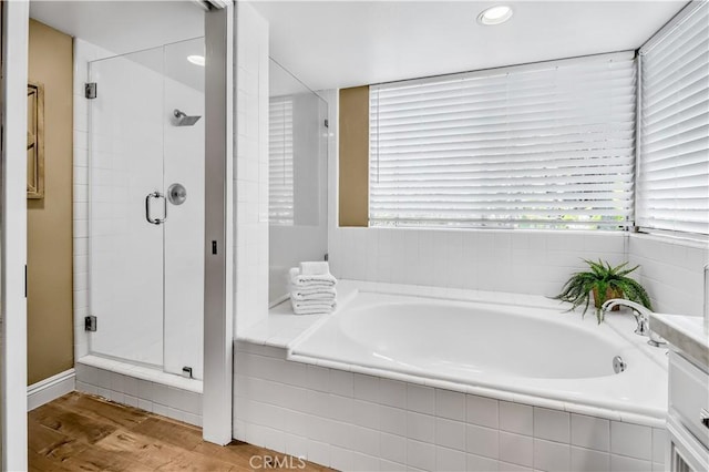 24676 Vista Cerritos, Calabasas, CA 91302 - bathroom featuring a shower stall, a garden tub, wood finished floors, and recessed lighting