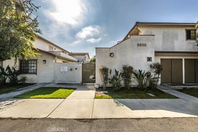 8800 Garden Grove Blvd Unit 2, Garden Grove, CA 92844 - view of front facade featuring a gate and stucco siding