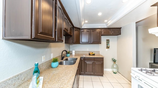8800 Garden Grove Blvd Unit 2, Garden Grove, CA 92844 - kitchen with dark brown cabinetry, ornamental molding, light tile patterned floors, a tray ceiling, and recessed lighting