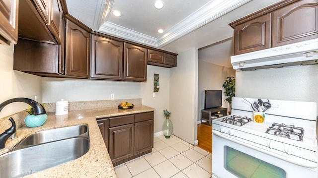 8800 Garden Grove Blvd Unit 2, Garden Grove, CA 92844 - kitchen featuring white gas range, under cabinet range hood, ornamental molding, light tile patterned flooring, and dark brown cabinetry