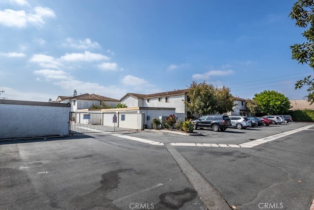 8800 Garden Grove Blvd Unit 2, Garden Grove, CA 92844 - view of front of house featuring a gate and uncovered parking