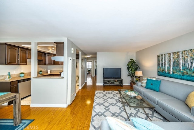 8800 Garden Grove Blvd Unit 2, Garden Grove, CA 92844 - living room featuring light wood-style floors and baseboards