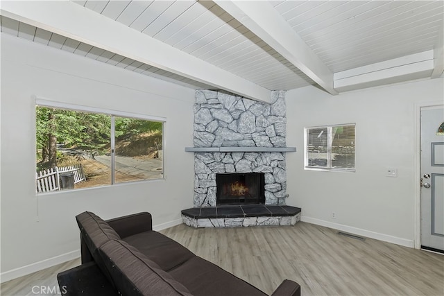 776 Lords Ln, Lake Arrowhead, CA 92352 - living room featuring a stone fireplace, wood finished floors, and a wood ceiling with exposed beams