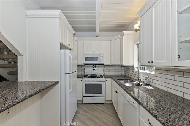 776 Lords Ln, Lake Arrowhead, CA 92352 - kitchen featuring white appliances, light wood-style flooring, backsplash, dark stone counters, and beamed ceiling