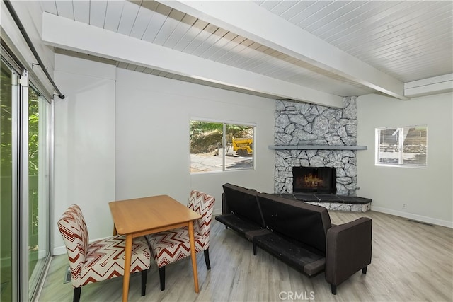 776 Lords Ln, Lake Arrowhead, CA 92352 - living area featuring beamed ceiling, light wood-type flooring, and a fireplace