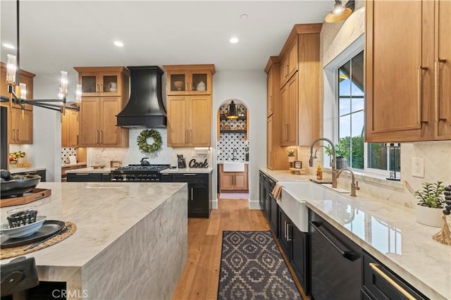 22388 Riverstream Ct, Saugus, CA 91350 - kitchen featuring custom exhaust hood, dishwasher, light wood-type flooring, recessed lighting, and tasteful backsplash