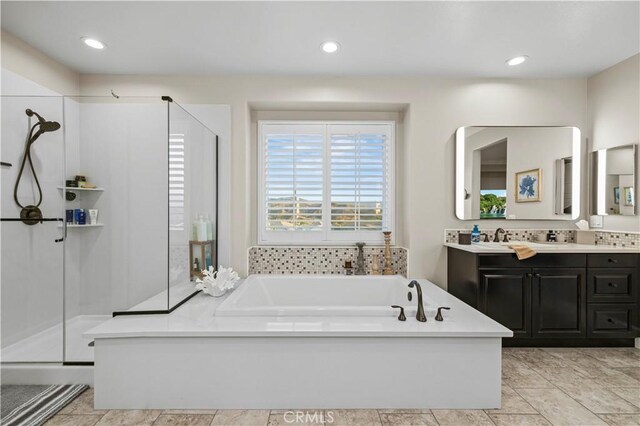 22388 Riverstream Ct, Saugus, CA 91350 - full bathroom featuring a stall shower, a bath, vanity, and recessed lighting