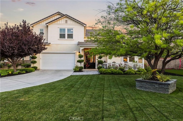 22388 Riverstream Ct, Saugus, CA 91350 - view of front of property featuring a garage, concrete driveway, stucco siding, a front lawn, and covered porch