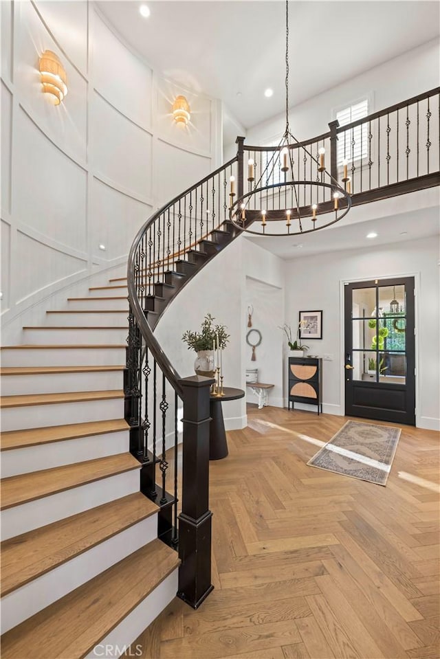 22388 Riverstream Ct, Saugus, CA 91350 - stairway featuring a high ceiling, plenty of natural light, and recessed lighting