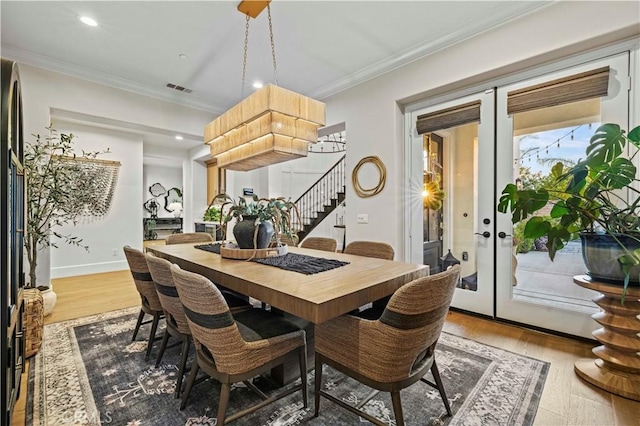 22388 Riverstream Ct, Saugus, CA 91350 - dining area featuring stairs, wood finished floors, ornamental molding, and recessed lighting