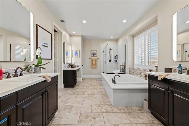 22388 Riverstream Ct, Saugus, CA 91350 - bathroom with a stall shower, two vanities, a bath, and recessed lighting