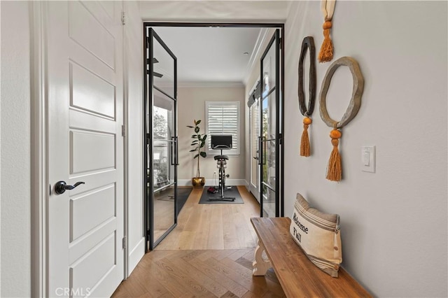 22388 Riverstream Ct, Saugus, CA 91350 - hallway with crown molding and light wood-style floors