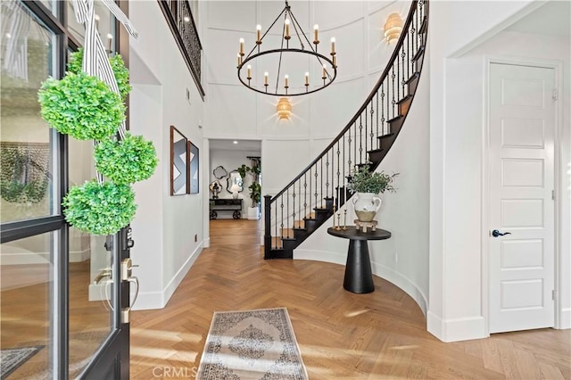 22388 Riverstream Ct, Saugus, CA 91350 - entrance foyer with stairs, a chandelier, and a high ceiling