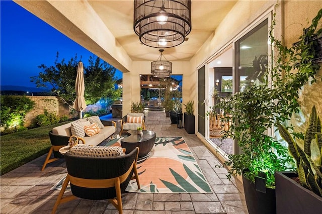 22388 Riverstream Ct, Saugus, CA 91350 - patio at night with an outdoor hangout area and a patio area