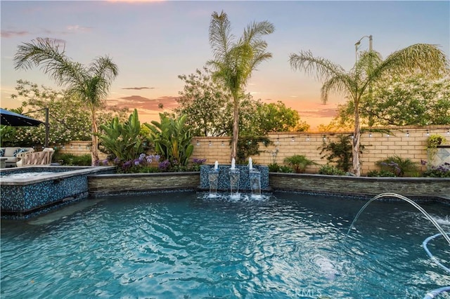 22388 Riverstream Ct, Saugus, CA 91350 - pool at dusk with a pool with connected hot tub