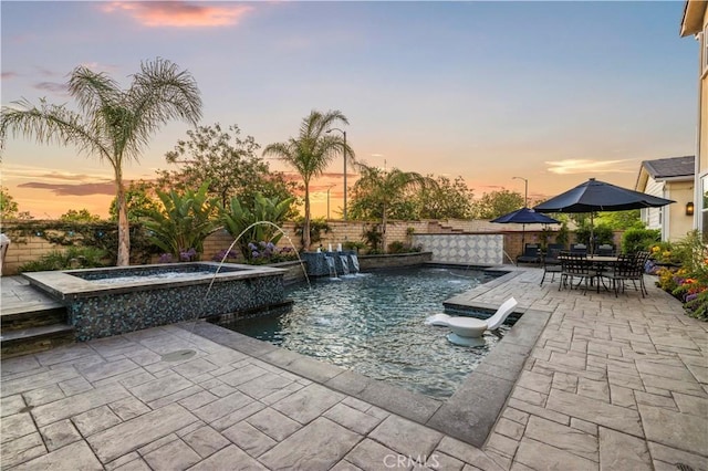 22388 Riverstream Ct, Saugus, CA 91350 - pool at dusk with a patio and a pool with connected hot tub