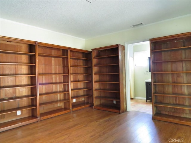 22727 Mariano St, Woodland Hills, CA 91367 - unfurnished room featuring a textured ceiling and wood finished floors