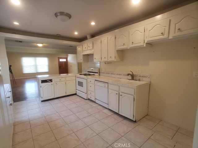 22727 Mariano St, Woodland Hills, CA 91367 - kitchen with white appliances, a peninsula, light countertops, white cabinetry, and light tile patterned floors