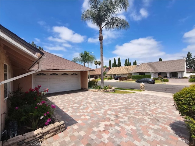 15202 Marne Cir, Irvine, CA 92604 - view of home's exterior with decorative driveway and an attached garage