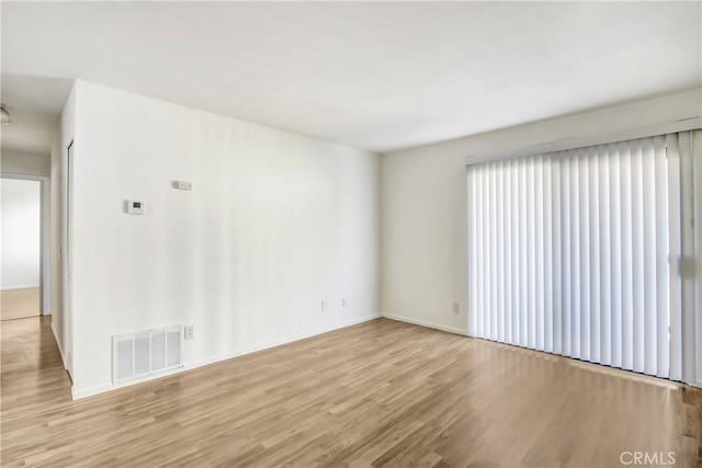 1265 Kendall Dr Unit 222, San Bernardino, CA 92407 - unfurnished room with wood finished floors and baseboards