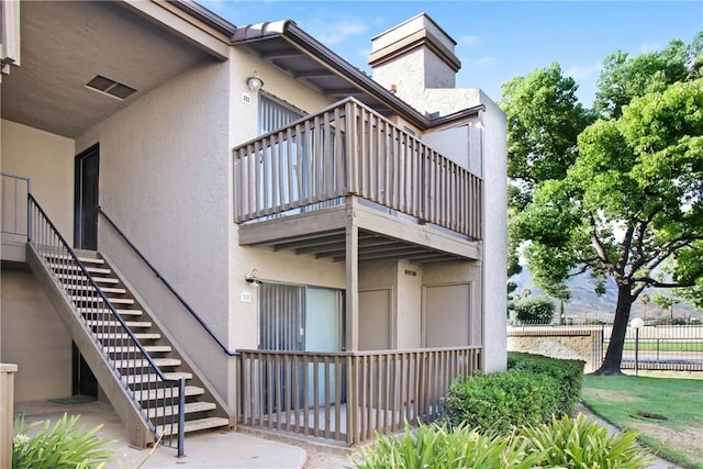 1265 Kendall Dr Unit 222, San Bernardino, CA 92407 - view of property featuring stairway