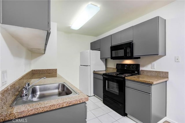 1265 Kendall Dr Unit 222, San Bernardino, CA 92407 - kitchen featuring black appliances, gray cabinets, light tile patterned floors, and light countertops
