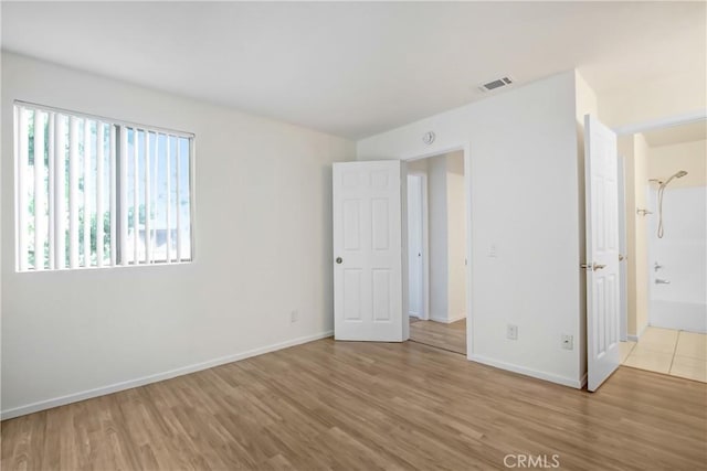 1265 Kendall Dr Unit 222, San Bernardino, CA 92407 - unfurnished bedroom with wood finished floors