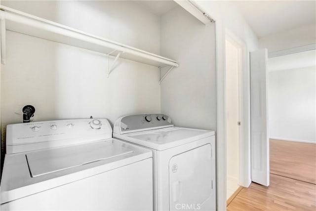 1265 Kendall Dr Unit 222, San Bernardino, CA 92407 - laundry area featuring light wood-type flooring and washer and clothes dryer