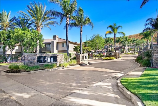 1265 Kendall Dr Unit 222, San Bernardino, CA 92407 - view of road featuring curbs, a residential view, and a gated entry