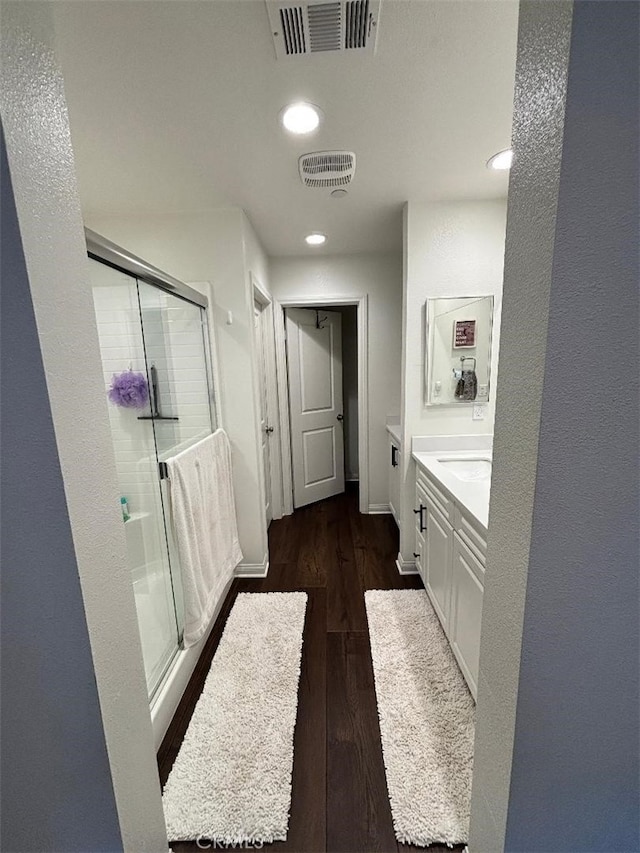 2717 Juniper Berry St, Spring Valley, CA 91977 - bathroom with a shower stall, vanity, recessed lighting, and wood finished floors