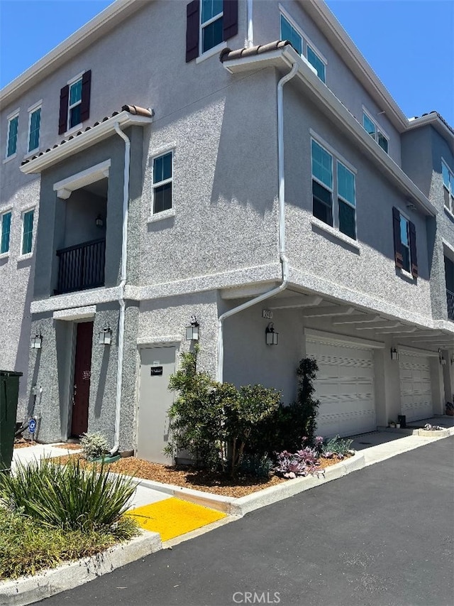 2717 Juniper Berry St, Spring Valley, CA 91977 - view of front of home featuring a garage and stucco siding