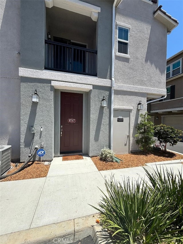 2717 Juniper Berry St, Spring Valley, CA 91977 - view of exterior entry featuring a balcony and stucco siding