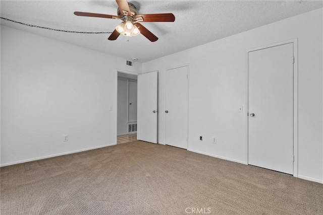 2231 Pacific Ave Unit 14, Costa Mesa, CA 92627 - unfurnished bedroom featuring carpet, ceiling fan, and two closets