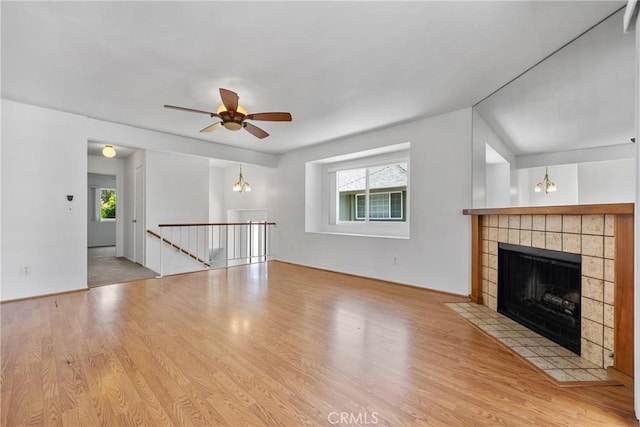 2231 Pacific Ave Unit 14, Costa Mesa, CA 92627 - unfurnished living room with plenty of natural light, wood finished floors, and ceiling fan