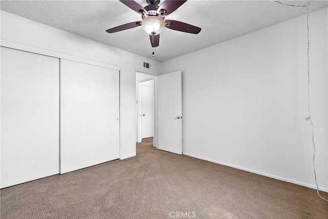 2231 Pacific Ave Unit 14, Costa Mesa, CA 92627 - unfurnished bedroom with carpet floors, a closet, and a ceiling fan