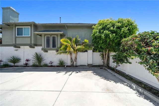 2231 Pacific Ave Unit 14, Costa Mesa, CA 92627 - back of house with a patio and a chimney