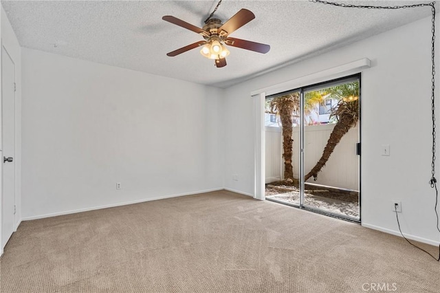 2231 Pacific Ave Unit 14, Costa Mesa, CA 92627 - carpeted empty room featuring a ceiling fan and a textured ceiling