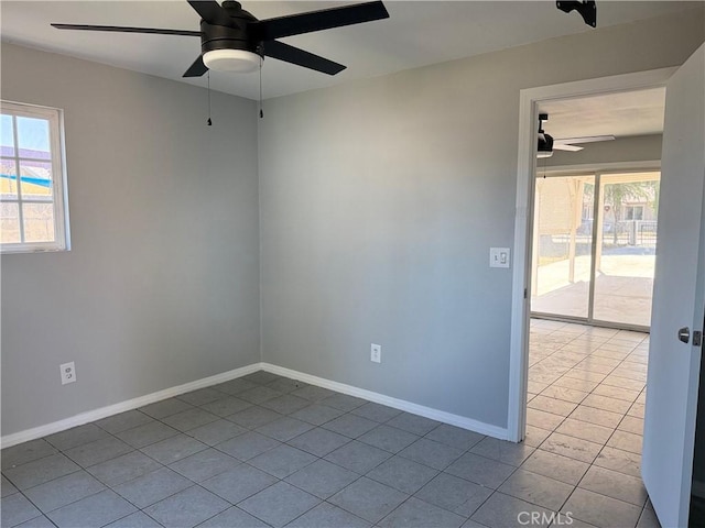 1271 N K St, San Bernardino, CA 92411 - tiled empty room featuring a ceiling fan and plenty of natural light