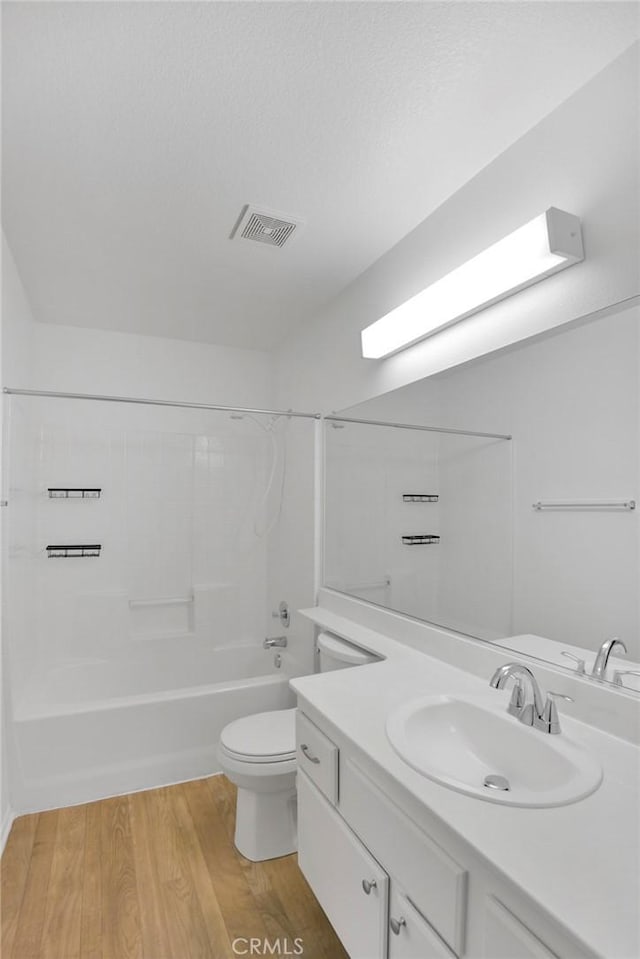 14183 Gale Dr, Victorville, CA 92394 - bathroom with vanity, shower / bathtub combination, and wood finished floors