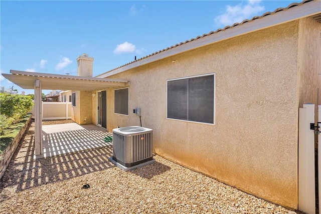 14183 Gale Dr, Victorville, CA 92394 - rear view of property with a patio, stucco siding, and a chimney