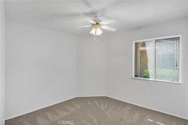 14183 Gale Dr, Victorville, CA 92394 - carpeted empty room with baseboards and ceiling fan