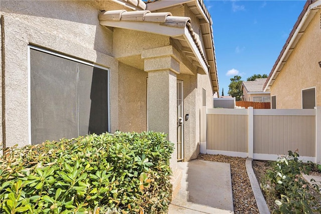 14183 Gale Dr, Victorville, CA 92394 - doorway to property featuring stucco siding