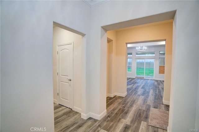 210 Kelly Ct, Atwater, CA 95301 - hall featuring a chandelier, wood finished floors, and crown molding