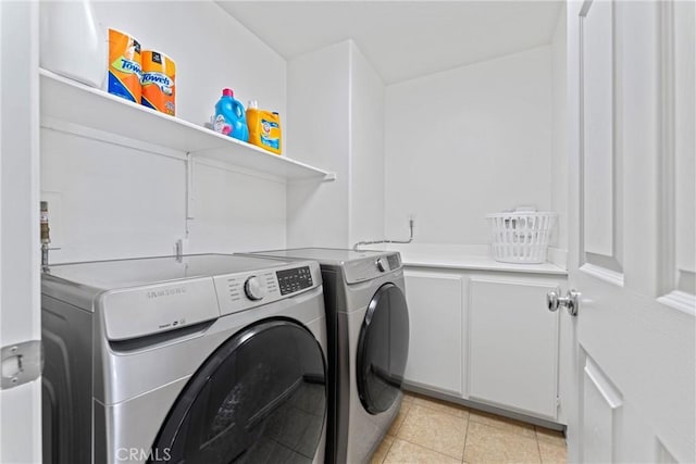 3020 Peaceful Way, Lancaster, CA 93535 - laundry room with washing machine and clothes dryer, cabinet space, and light tile patterned floors
