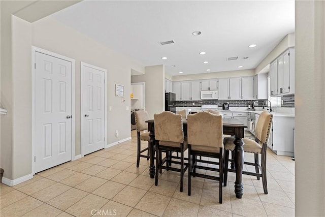 3020 Peaceful Way, Lancaster, CA 93535 - dining room with light tile patterned flooring and recessed lighting