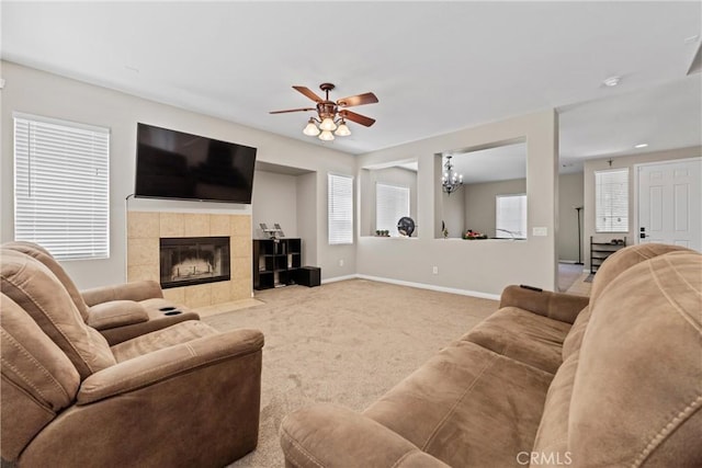 3020 Peaceful Way, Lancaster, CA 93535 - living area with a ceiling fan, carpet floors, a tiled fireplace, and a chandelier