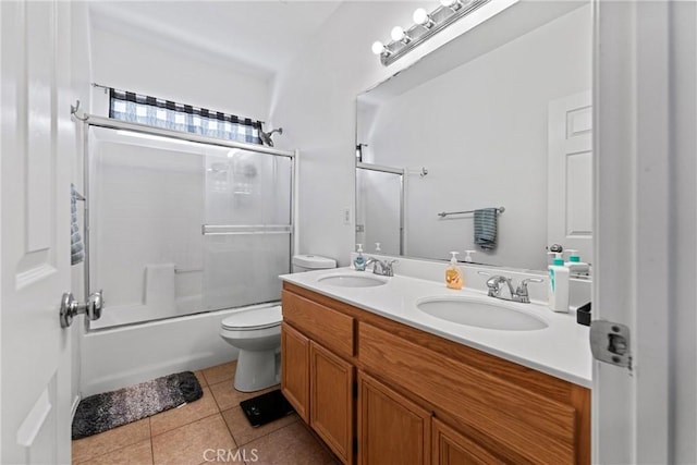 3020 Peaceful Way, Lancaster, CA 93535 - full bathroom with tile patterned flooring, double vanity, and bath / shower combo with glass door